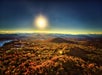 View of illuminated fall colors from a scenic helicopter tour in Asheville, NC.