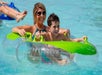 A mother and son floating in a tube in the water and smiling at Schlitterbahn New Braunfels in San Antonio, Texas.