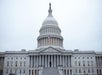 Capitol proud, flag flying—America’s seat of democracy stands bold in morning light.