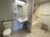 Accessible bathroom with roll-in shower available upon request at Econo Lodge, Branson, Missouri.