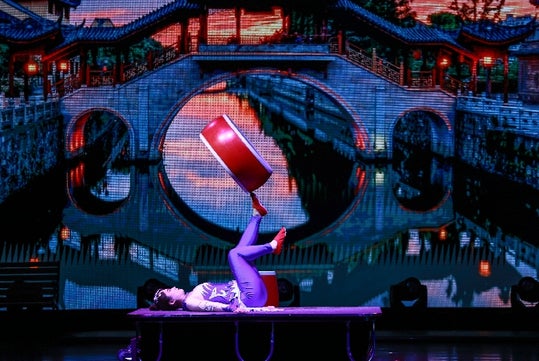 Acrobat performer on stage at Mickey Gilley Grand Shanghai Theatre in Branson, MO.
