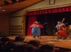 The cast of bluegrass performers on stage playing music at Shepherd of the Hills in Branson, Missouri.