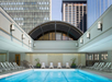 Swimming pool with loungers on the side.