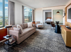 Suite with a separate living area and dining table and chairs.