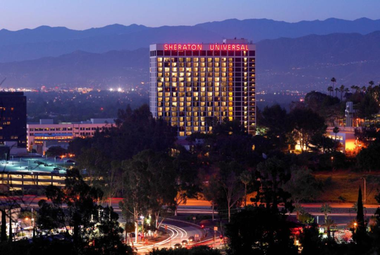 Hotel exterior at night.