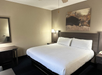 Enjoy the comfort of a plush king bed, ideal for unwinding after a long day.
