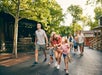 Families walking and having fun on a sunny day at Silver Dollar City in Branson, Missouri.