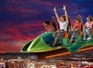 People riding the X-Scream at The STRAT at sunset in Las Vegas, Nevada.