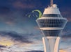 Wide shot of the SkyPod at The STRAT at dusk with a cloudy sky in Las Vegas, Nevada.