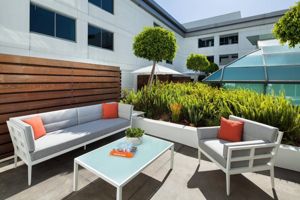Relax and unwind in style with comfortable outdoor seating and fresh air.