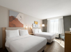 Enjoy a relaxing night’s sleep in two cozy queen beds.