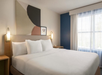1 King bed inside a guest room.