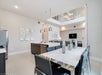 Spacious dining and kitchen areas with modern appliances and furnishing.