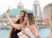 Two women taking a selfie.
