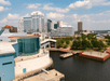 Aerial view looking over a small marina and the city of Williamsburg on a sunny day.