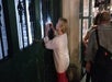A woman takes a photo during the Family-Friendly Ghost Tour