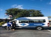 Gray Line tour guide assisting guests upon arrival