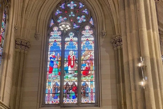 A beautiful and intricate stained glass window in St. Patrick's Cathedral on the Official Self-Guided Audio Tour.