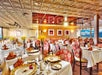 Red chairs and ornate ceilings aboard the boat