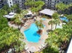 Outdoor pool and hot tub at Staybridge Suites Orlando Royale Parc Suites.