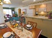Guest suite with dining and living area and a full kitchen.