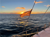 Cruising on the ocean while watching the sunset in Waikiki, Hawaii.