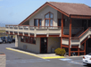 Hotel exterior and parking space.