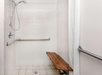 Accessible shower inside a private bathroom.