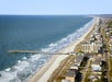 Aerial view of the pier at Surfside Beach Resort and Surfside Beach.