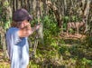 Guest shoots at a deer target with a bow and arrow