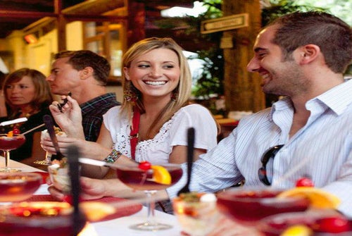 Guests having fun and enjoying a signature cocktail along the tour.