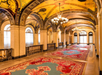 Make your way through the elegant hallway.