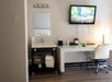 Stay productive and entertained with a work desk and a flat-screen TV inside a guest room.