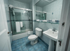 Marble bathroom with show and tub combination.