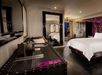 One king bed and flat-screen TV inside a guest room.