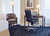 A spacious work desk inside a guest room.