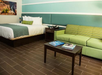 King room, 1 king bed, seating area at The Flagler Inn - Saint Augustine, FL.