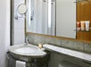 Guest bathroom with modern amenities and toiletries.