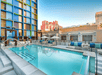 Outdoor pool with loungers.