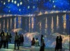 People observe a large immersive projection of Van Gogh's "Starry Night Over the Rhône," with reflections of lights on the water and vivid blue and yellow tones.