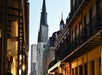 View looking up at historic buildings at dusk on the French Quarter Haunted Ghost Tour.