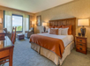 King room with carpeted floors, and seating for two with mountain view