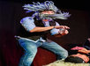 A man performing his act at The Outta Control Magic Comedy Dinner Show