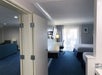 Executive Family Suite with two beds, flat-screen TV and desk chair.