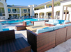 Relax at the poolside seating area complete with a fire pit.