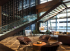 Lobby with a seating area and a staircase leading to the upper floor.