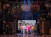 Broadway cast onstage portraying a chaotic home construction scene.