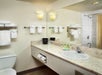 Guest bathroom with towels and toiletries.