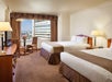 Two queen beds and blackout drapes.