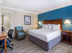 Rest easy in a king bed and get work done at the desk.